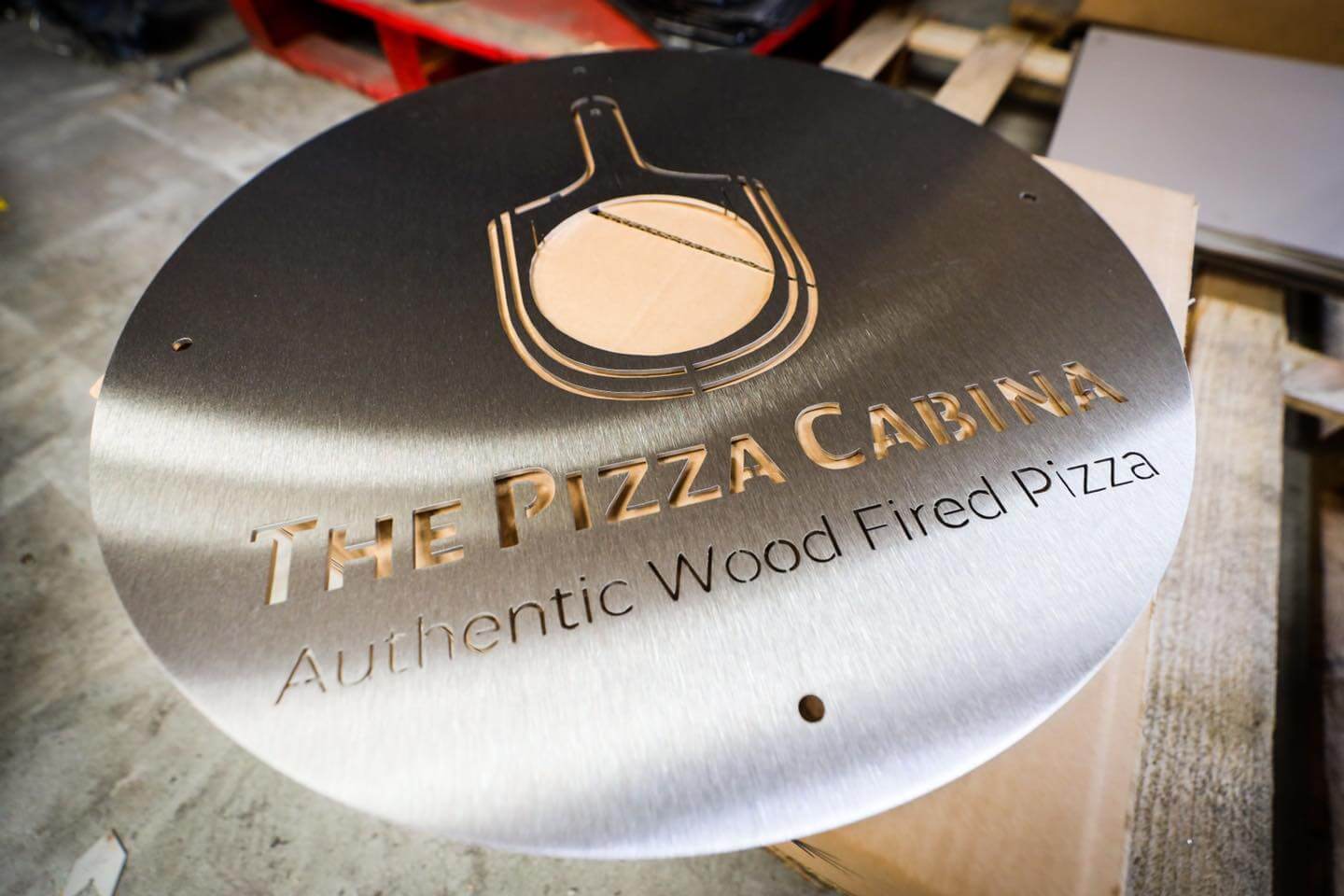 pizzeria sign cut from sheet metal